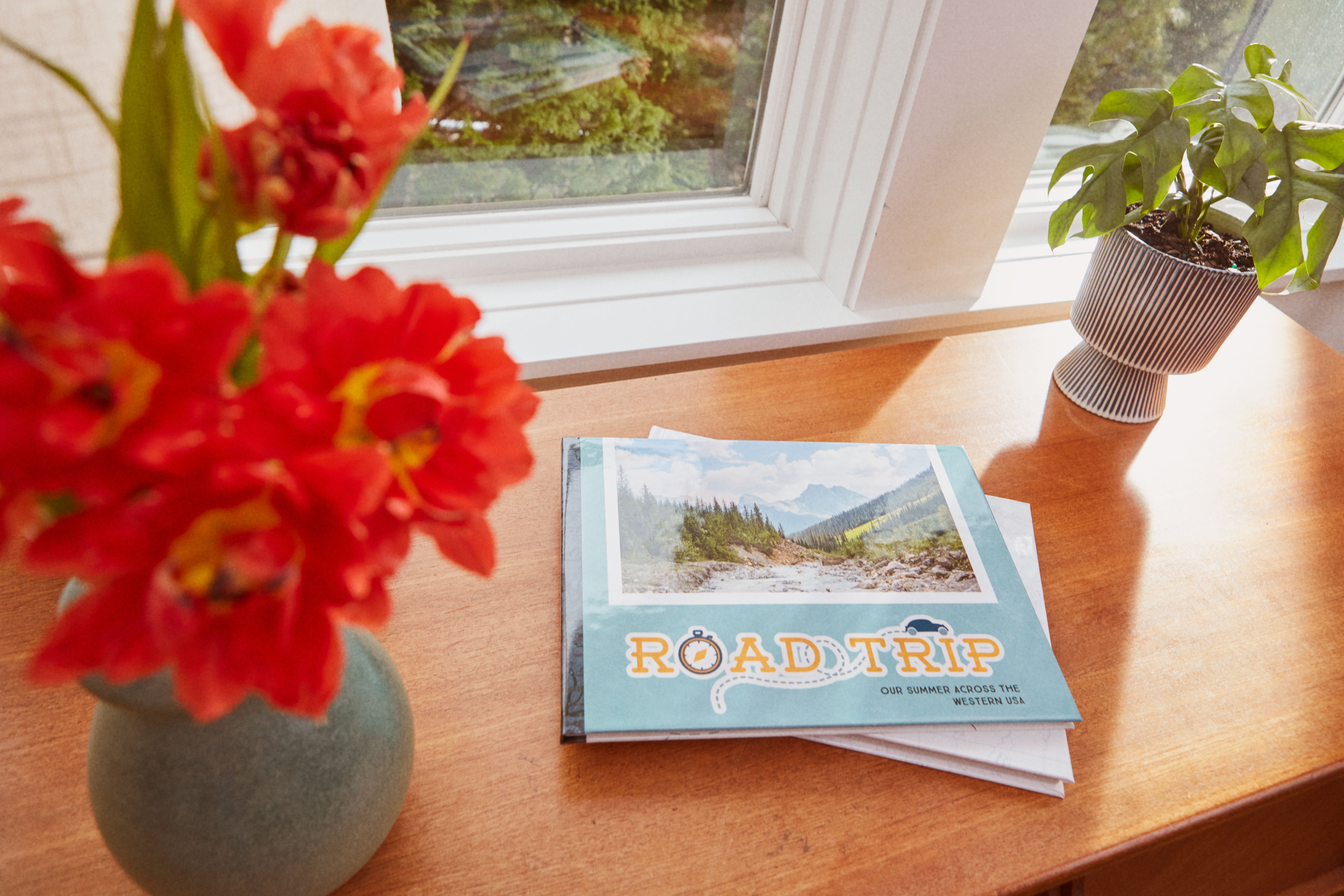 A custom travel photo book that says road trip