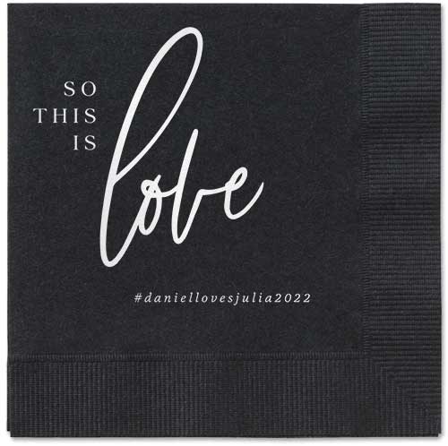 Personalized wedding napkins that read So This Is Love with hashtag